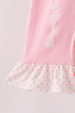 Pink skeleton print ruffle romper